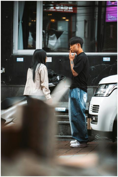 Young adults engaged in a conversation on a Seoul