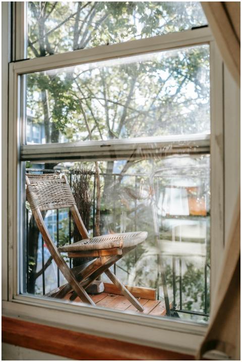 Through apartment window glass view of rustic wood