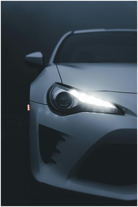 Close-up of a modern sportscar with its headlights