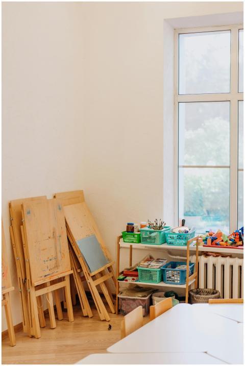 Cozy art room with kids easels, educational suppli