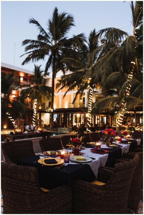 Nighttime al fresco dining at a tropical resort wi