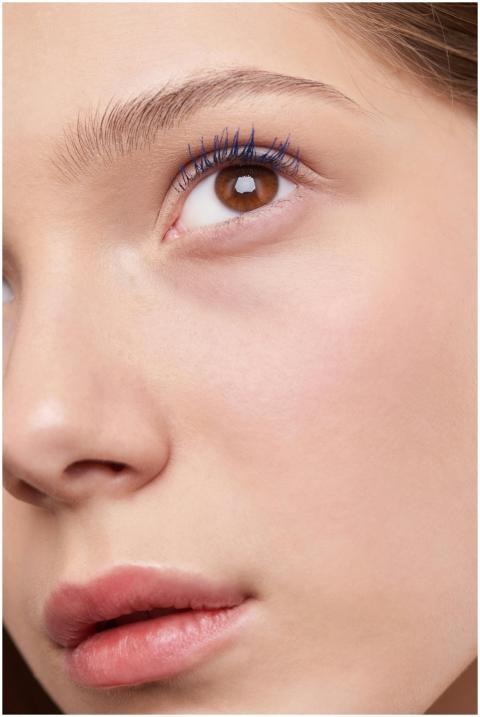 Close-up view of a woman's eye emphasizing natural