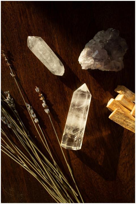 A calming flat lay of crystals, lavender, and palo