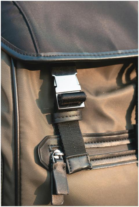 Close-up of a stylish nylon backpack featuring a m