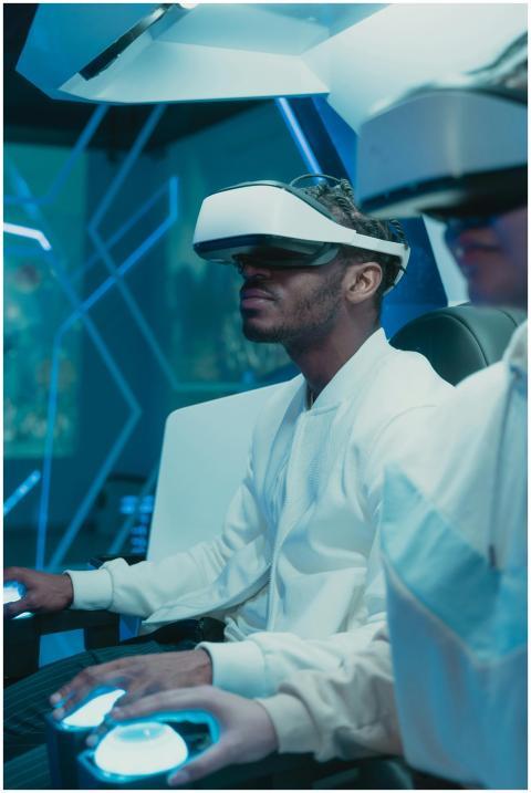 Two adults engaged in virtual reality gaming, expl