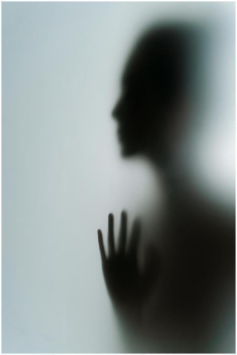 Abstract silhouette of a person with hand on frost