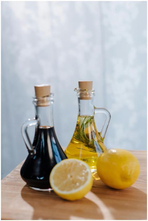 Halved lemon with Italian olive oil and balsamic v