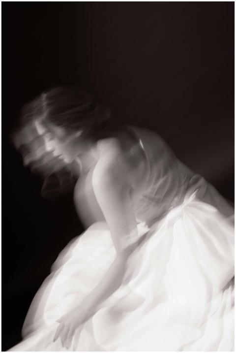Elegant black and white blurred motion portrait of