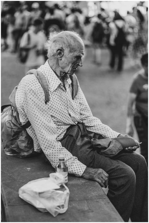 Black and white portrait of an elderly man sitting
