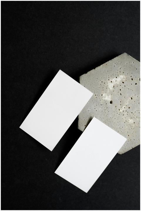 A minimalist mockup featuring two blank business c