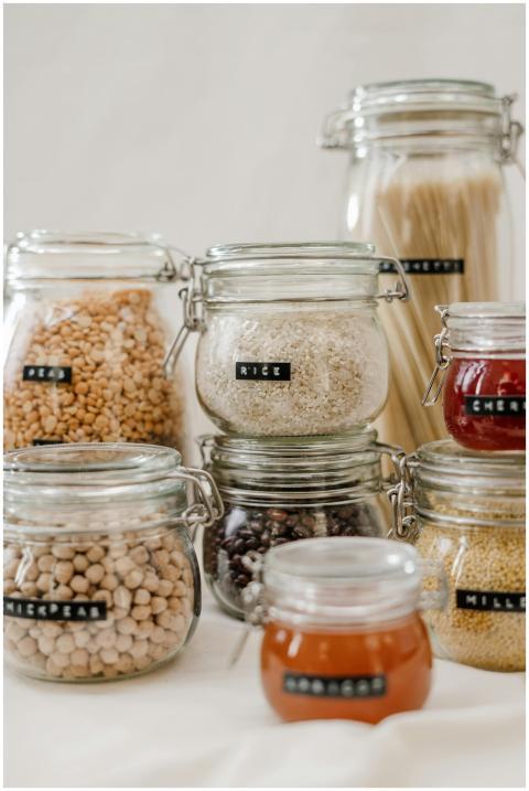 Glass jars filled with diverse kitchen ingredients