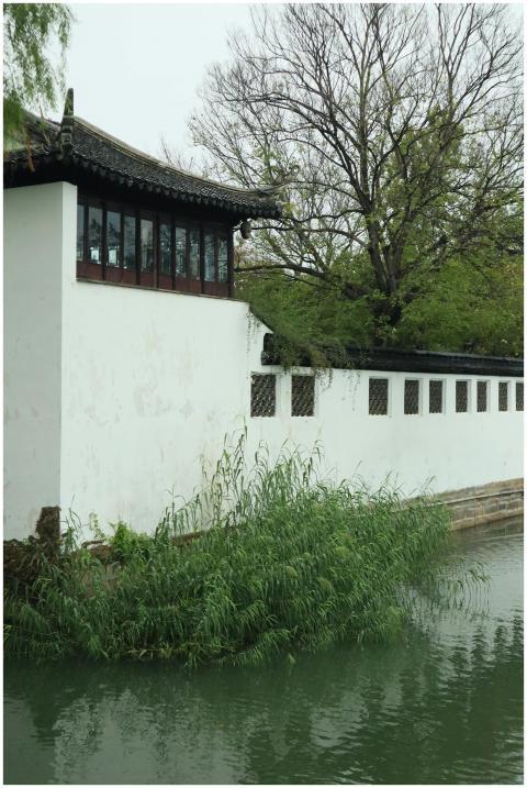 Serene view of traditional Chinese building by a c
