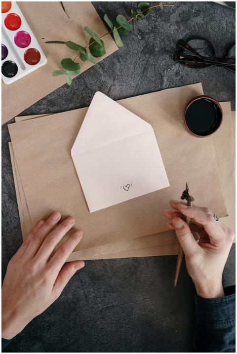 Elegant setup with calligraphy tools, envelope, an