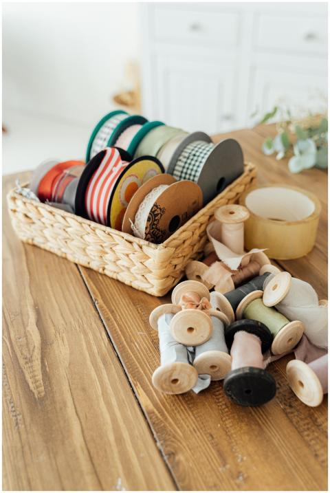 A collection of ribbons and sewing materials in a