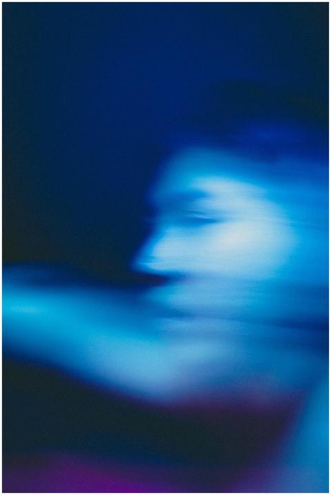 Abstract blurred portrait with blue ethereal tones