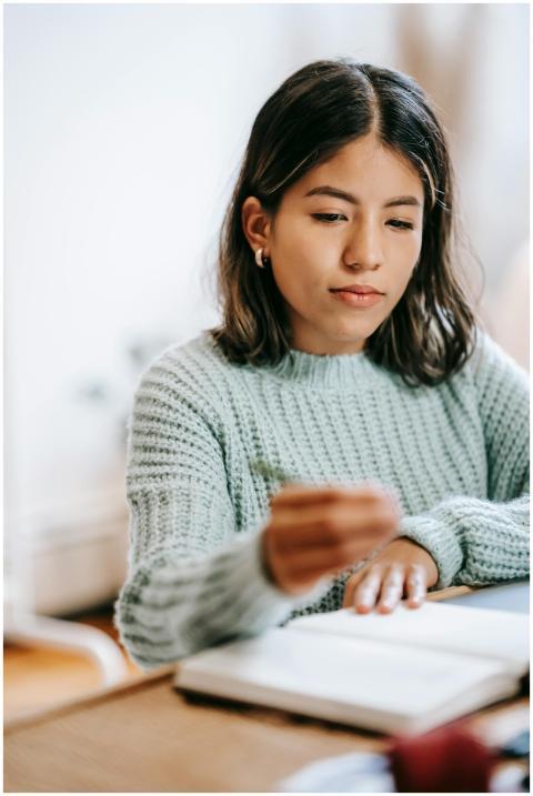 Concentrated young ethnic female with short dark h