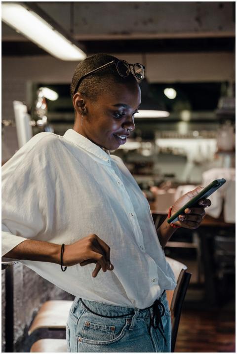 Young confident African American lady in trendy ca