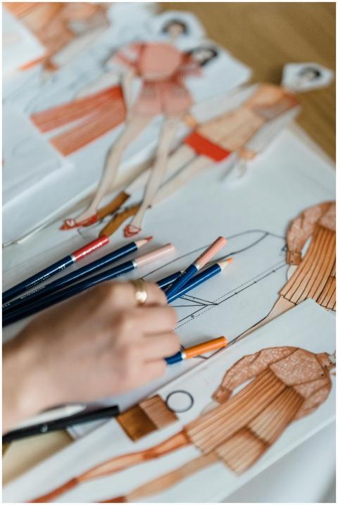 High angle of crop anonymous illustrator working a