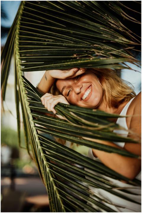 Smiling woman with blonde hair enjoying sunny day