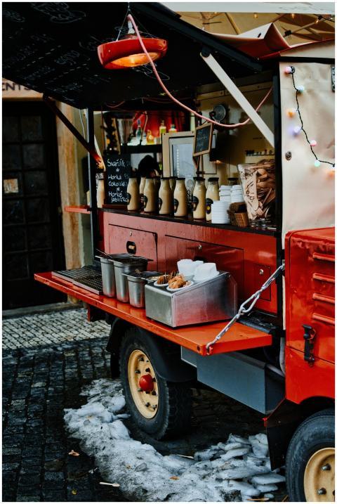 Vibrant red food truck offering street food in an