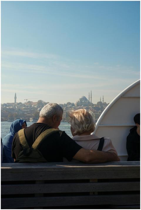 A senior couple on a ferry admiring the Istanbul s