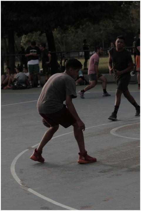A group of young men playing a lively game of bask