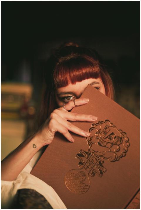 Mysterious portrait of a young woman with fringe h
