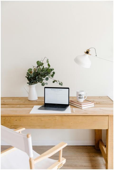 Stylish minimalist workspace with a laptop, lamp,