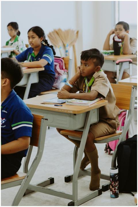 Students attentively listening in a classroom in T