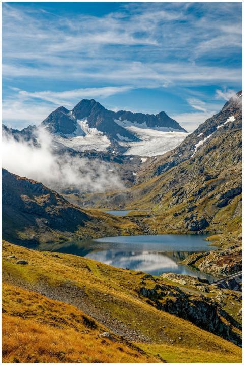 Breathtaking view of alpine mountains with snow an