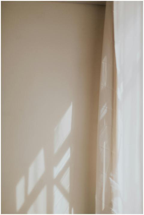 A serene indoor scene with light and shadows playi