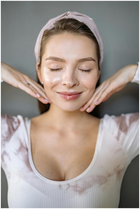 A serene portrait of a smiling woman with eyes clo