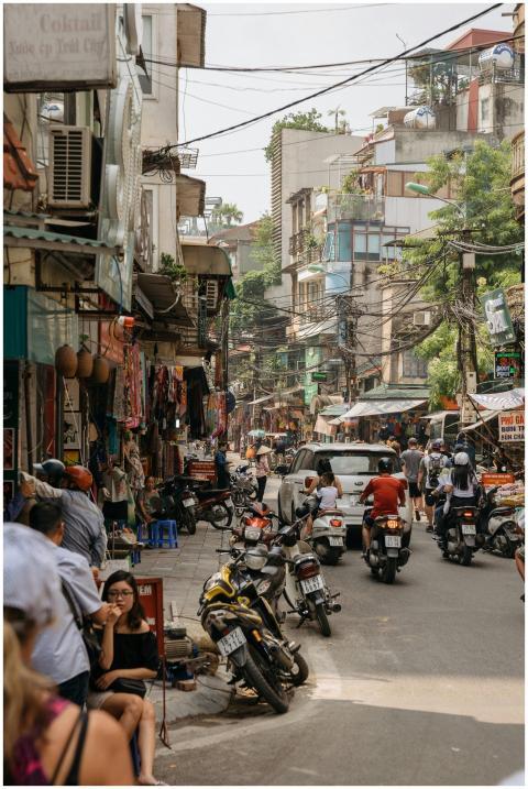 Vibrant street life in Dong Da, Hanoi, with motorb
