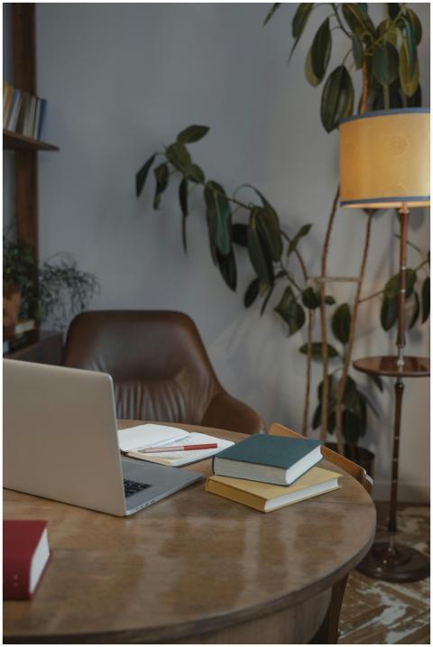 Inviting home office setting with laptop, books, a