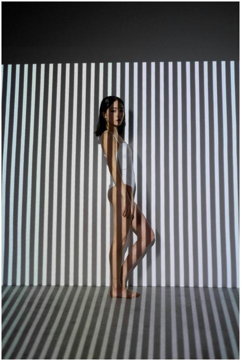 Creative photo of a woman with body suit and shado