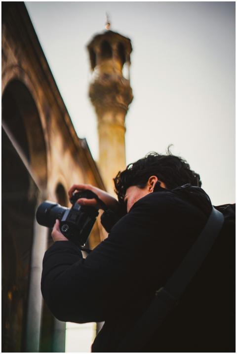 A person photographing historical architecture und