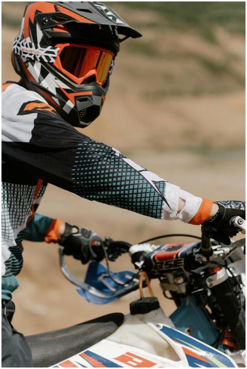 Motocross rider in action, showcasing extreme spor