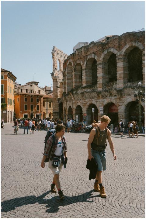 Travelers walking near the historic Verona Arena i