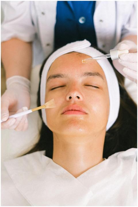 Top view skilled female cosmetologist in uniform a