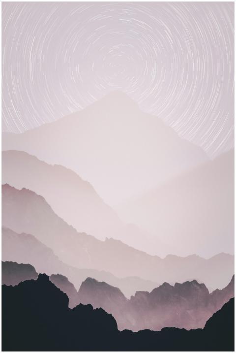 Dreamy mountain silhouette with swirling star trai