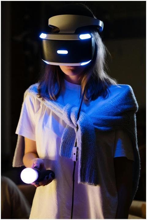 A young woman immersed in virtual reality gaming,