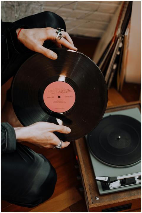 Close-up of hands with rings holding a classic vin