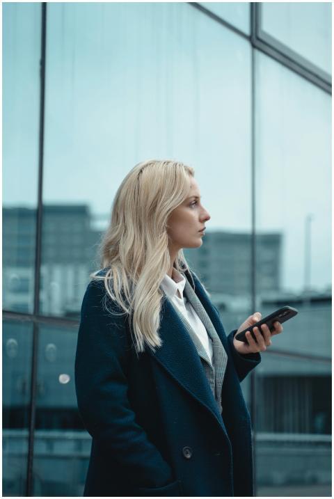 Side profile of a businesswoman in an urban settin