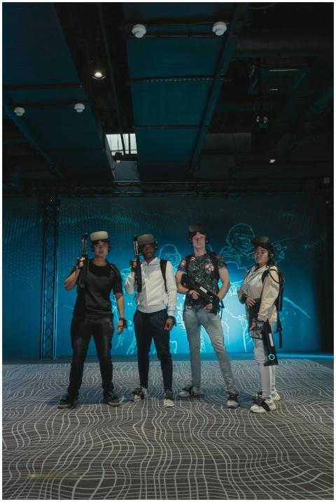 A diverse group of adults enjoying an immersive VR