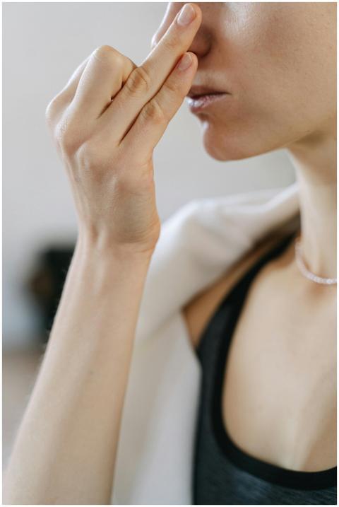 Focused close-up of a woman practicing yoga breath