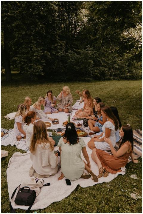 Group of women having a picnic in a park, enjoying
