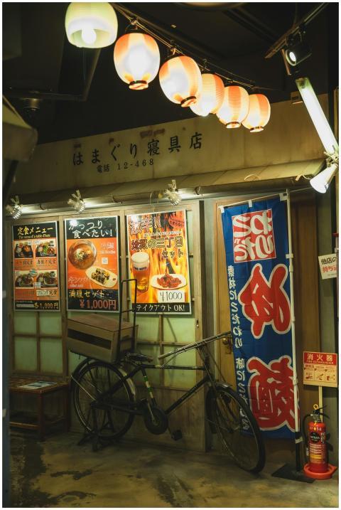 Cozy Japanese street corner with lanterns, bicycle