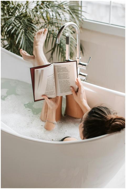 A cozy indoor scene of a woman enjoying a relaxing
