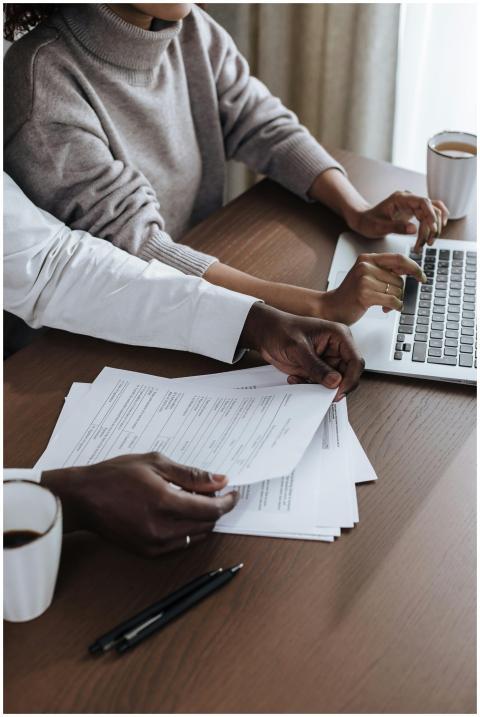 Close-up of diverse colleagues working together on
