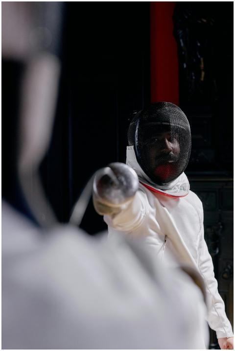Close-up of a fencer in action during a duel, show